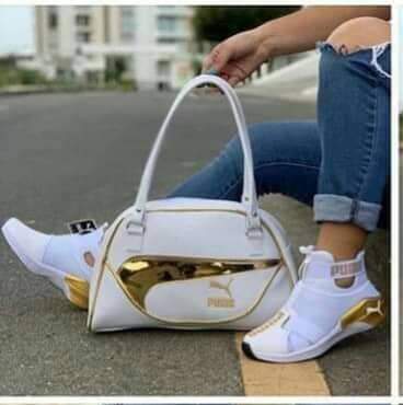 white and gold pumas with purse