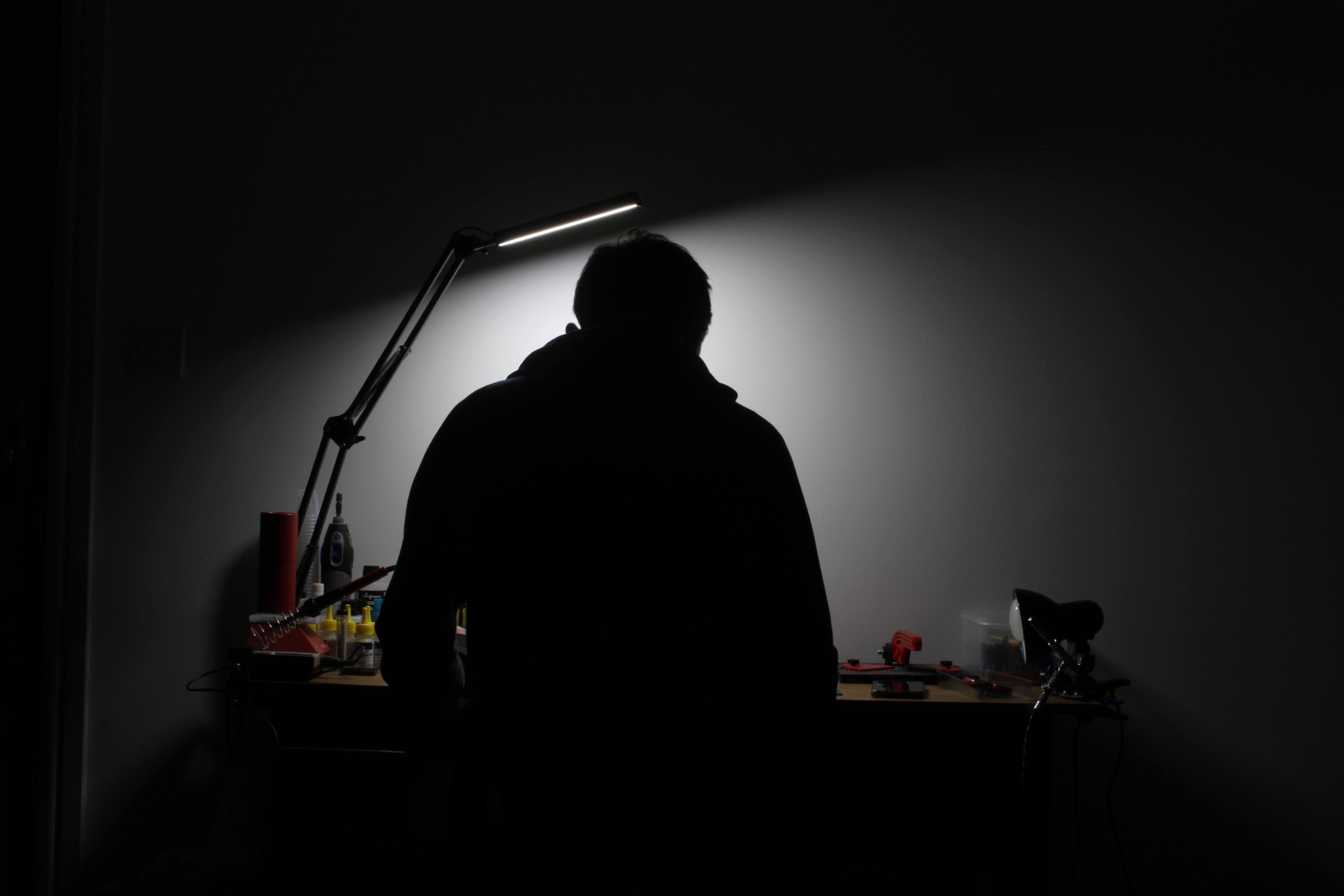 Time Capsule Scratch Builder at his desk in the dark