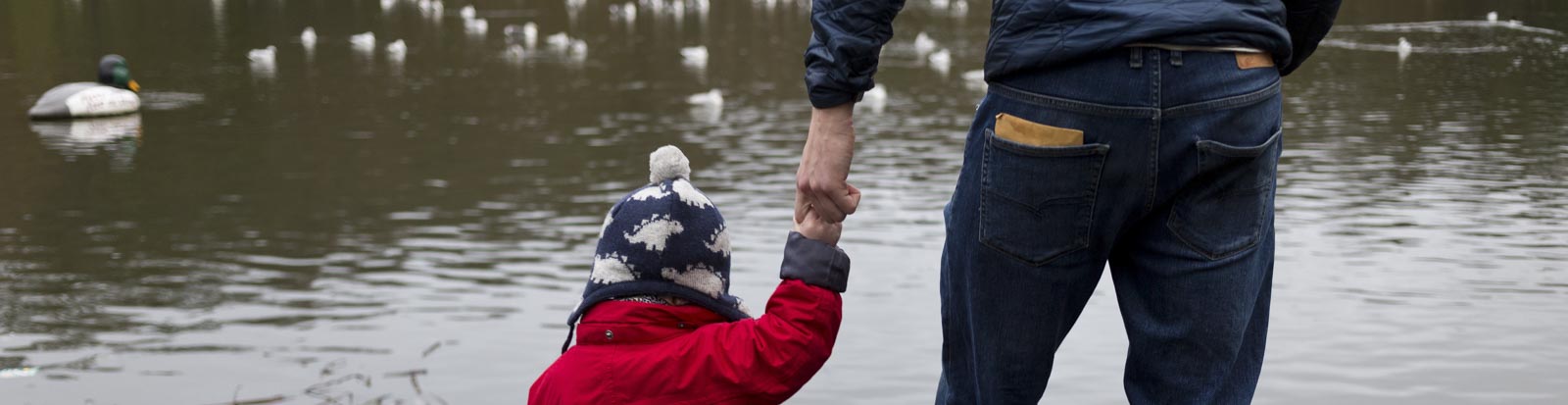 Father holding hands with son