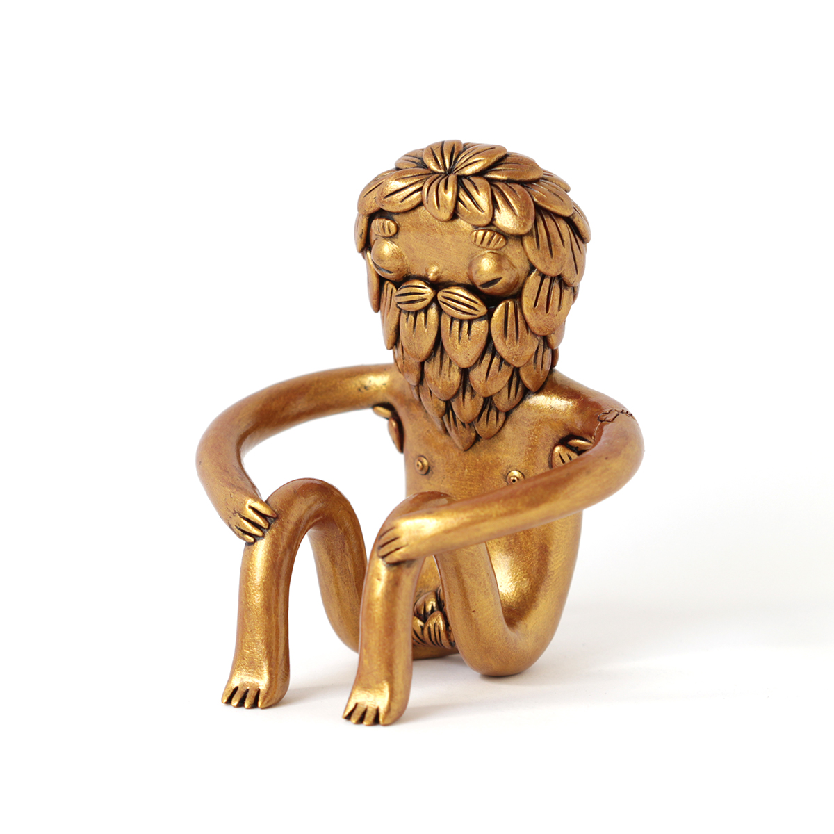 Golden polymer clay sculpture of an hermaphrodite being