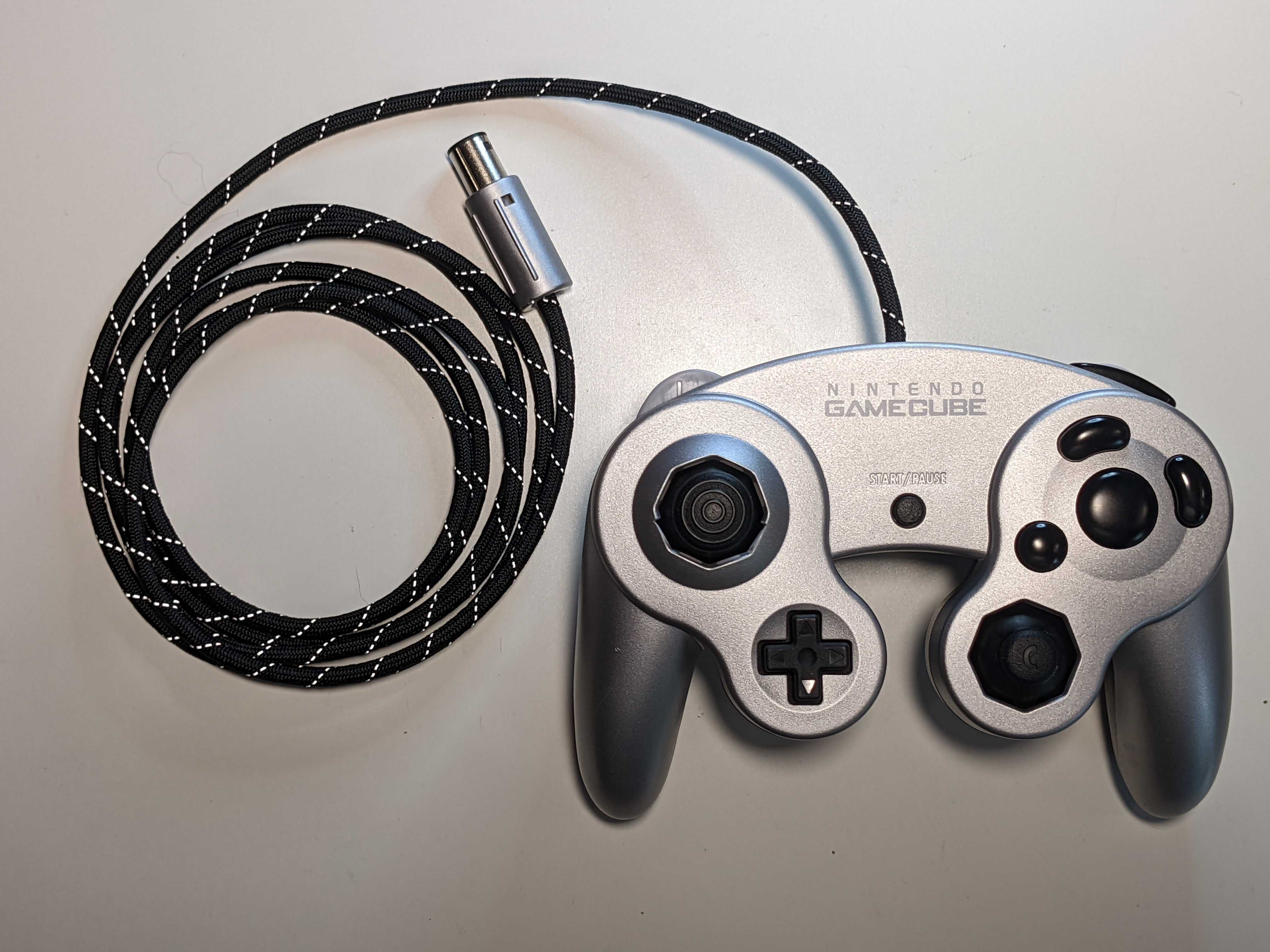 A GameCube controller with a paracorded cable