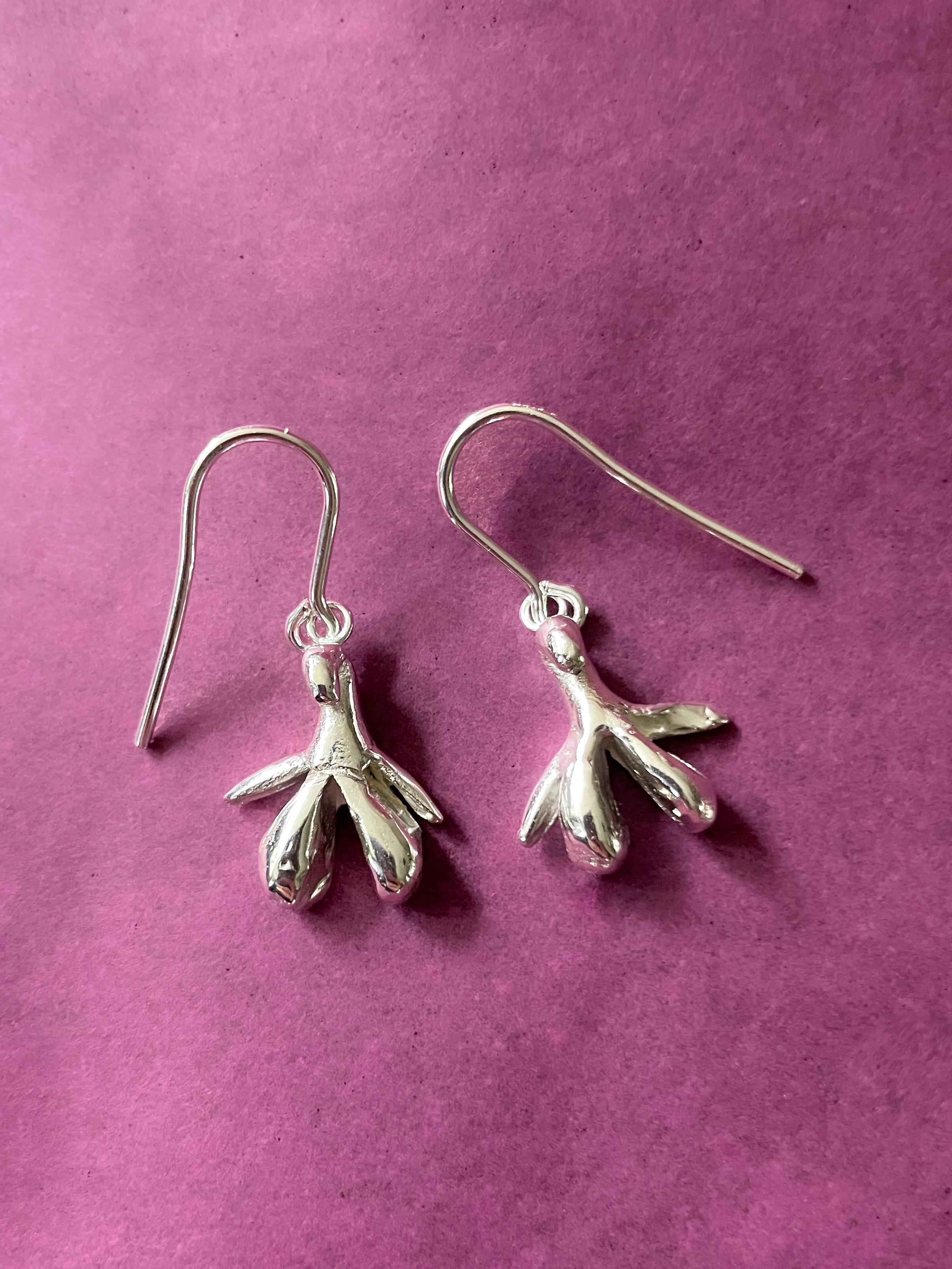 clitoris earrings cast in silver after workshop