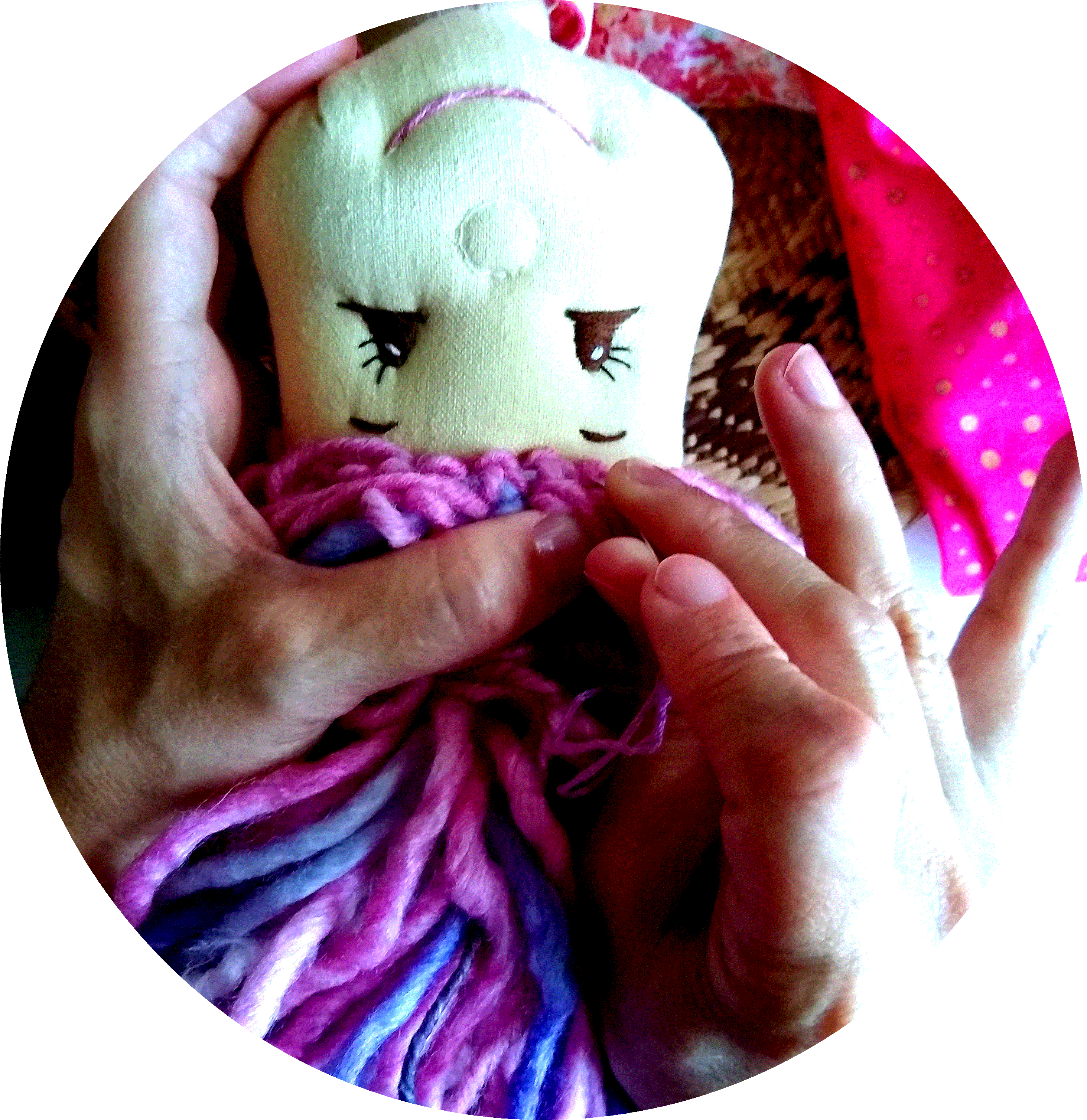 hands sewing on doll hair