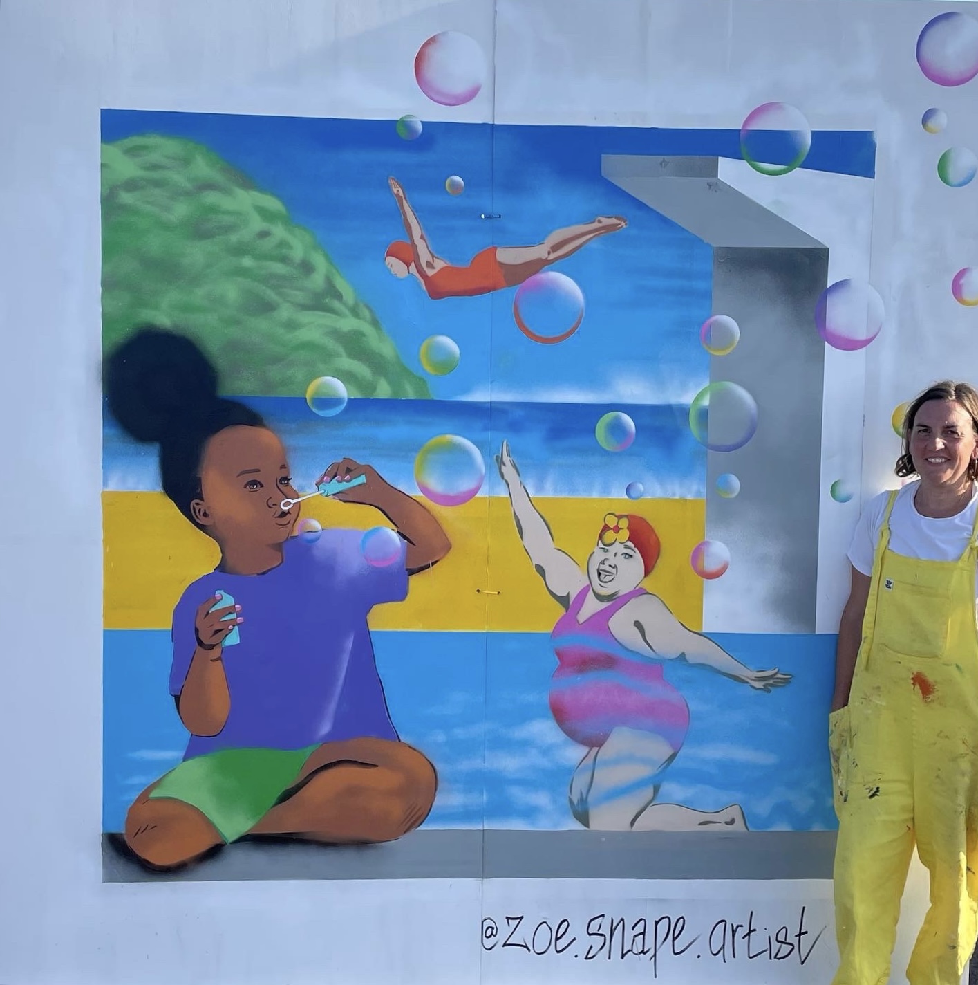 Zoe standing beside her 8x8 feet painting