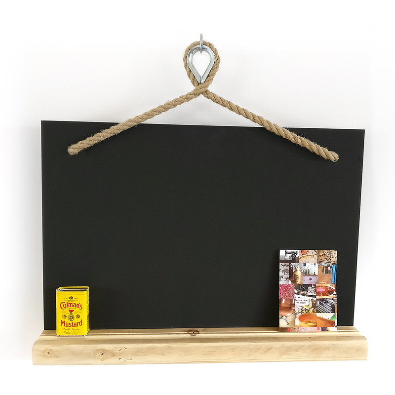Magnetic chalk board hung from hemp rope with steel thimble