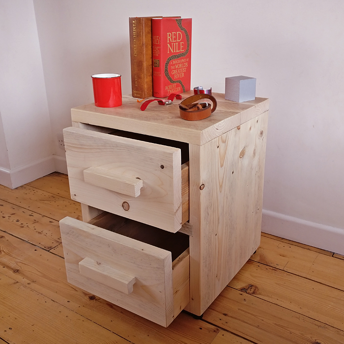 Reclaimed wood bedside table with drawers open