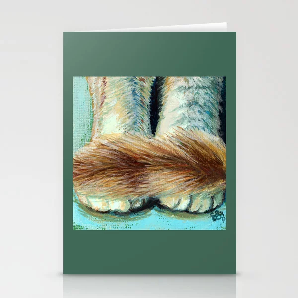 Greeting card featuring paws of a sitting orange and white cat with her tail gently resting across the front of her toes.