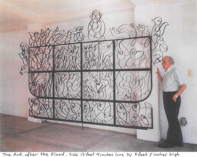 Photograph of Manuel Bennett with his sculpture The Ark After the Flood (2000)