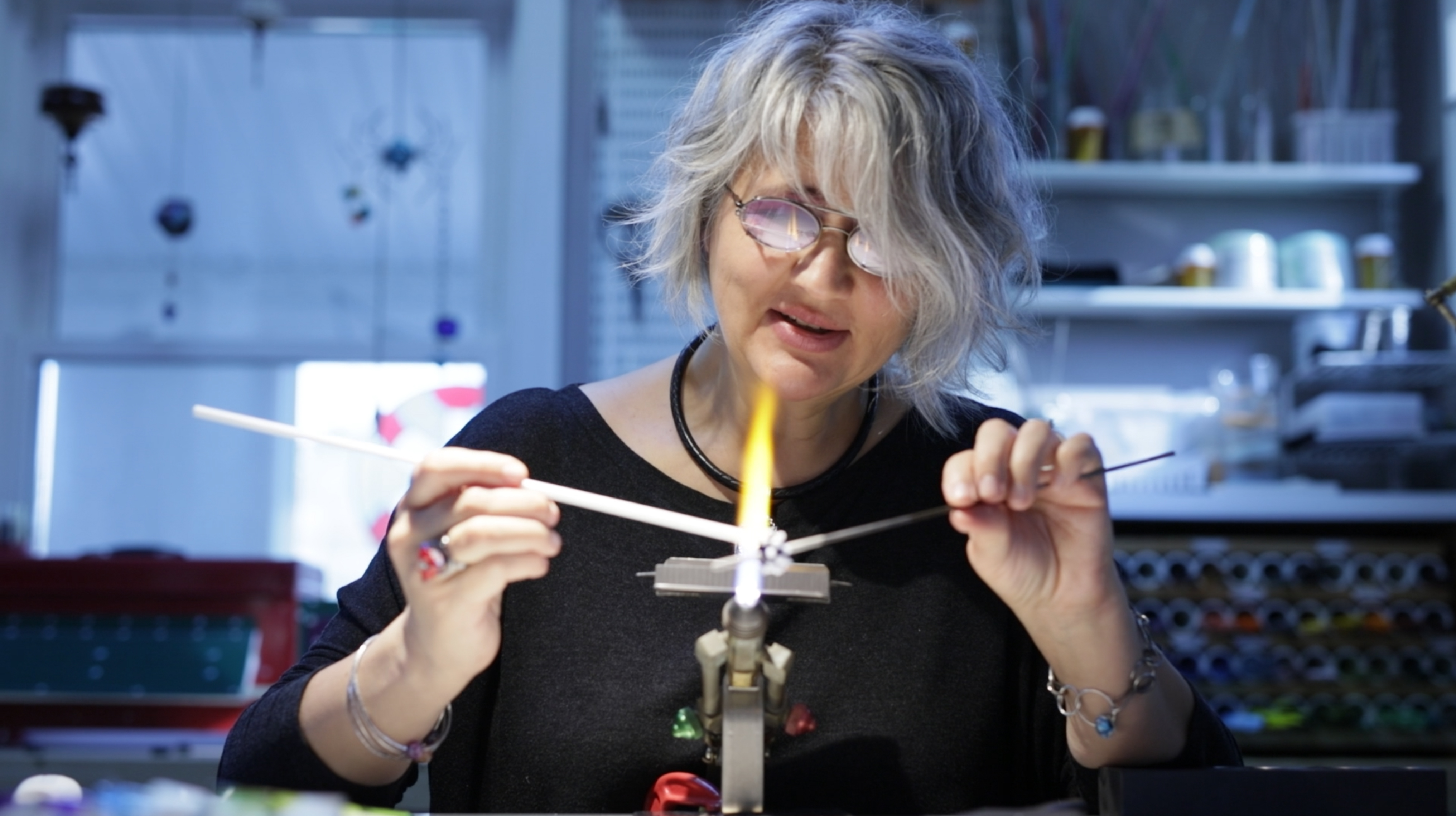 Liliana Glenn is creating her art glass objects at the torch. Photo by Oliver Thom, www.ojrtphotography.com