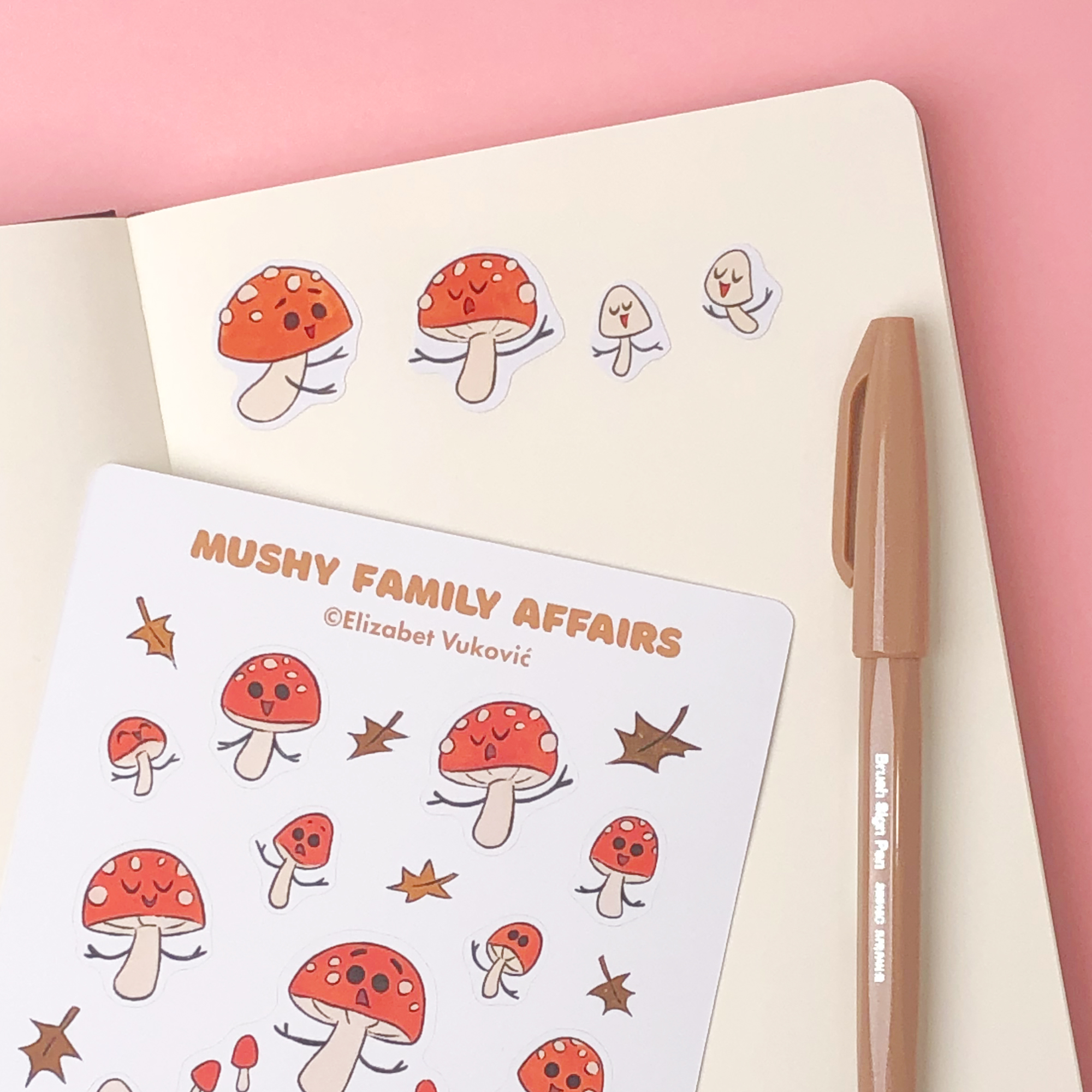 Notebook page with mushroom stickers, mushrooms are characters