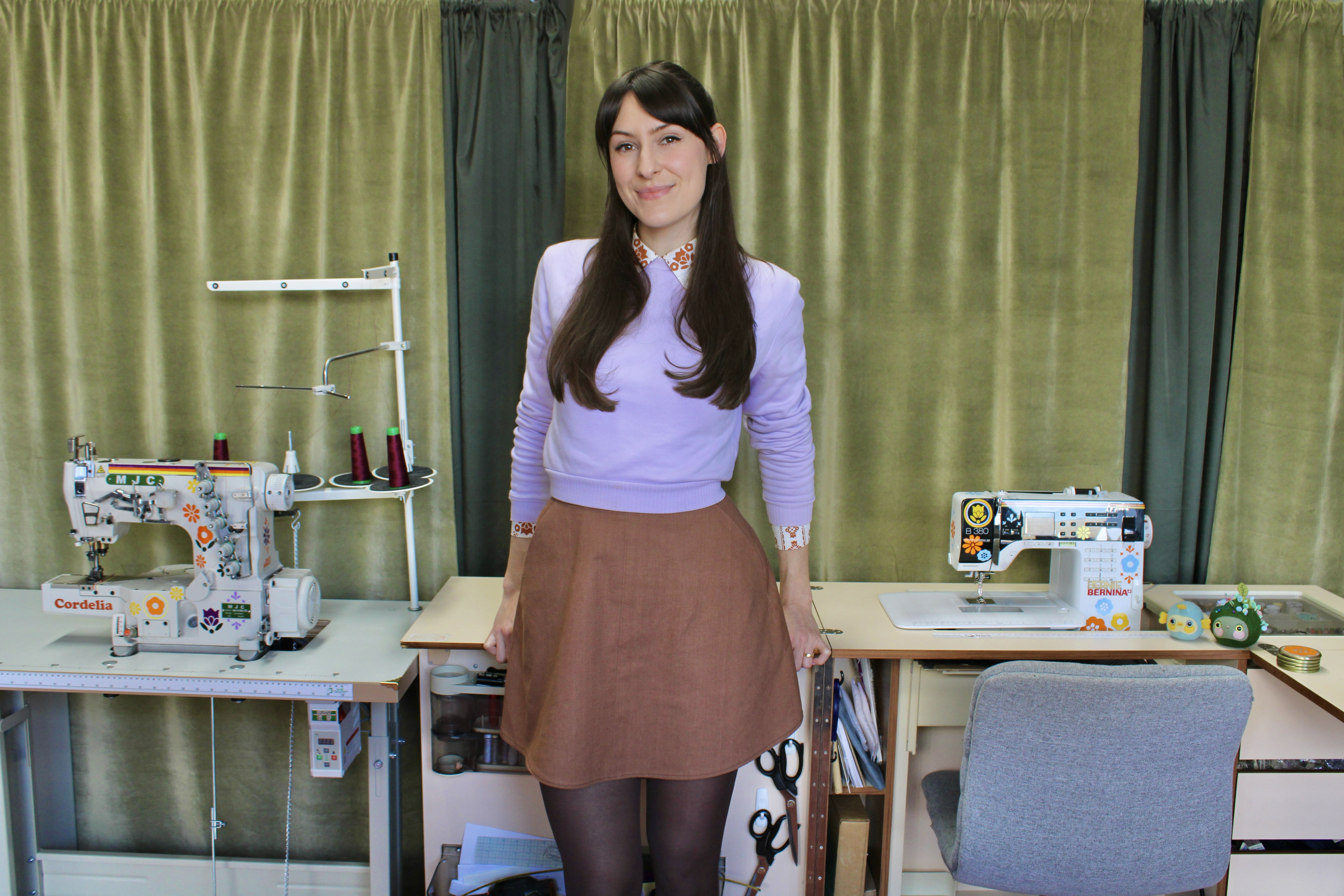 The founder of Uncle Phuncle, Ash, stands in front of the sewing machines in the Phuncle studio 