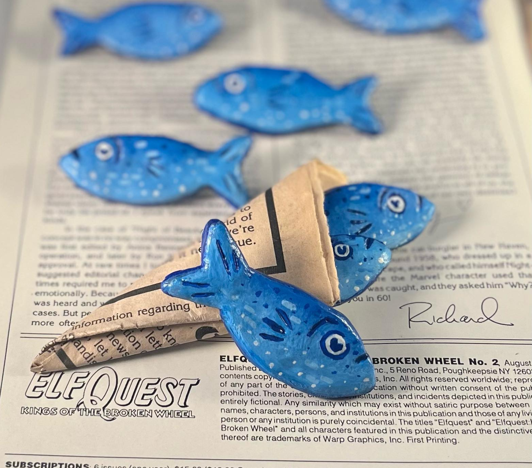 Hand painted blue fish pins, they look very much like sardines but are relatively cartoonish