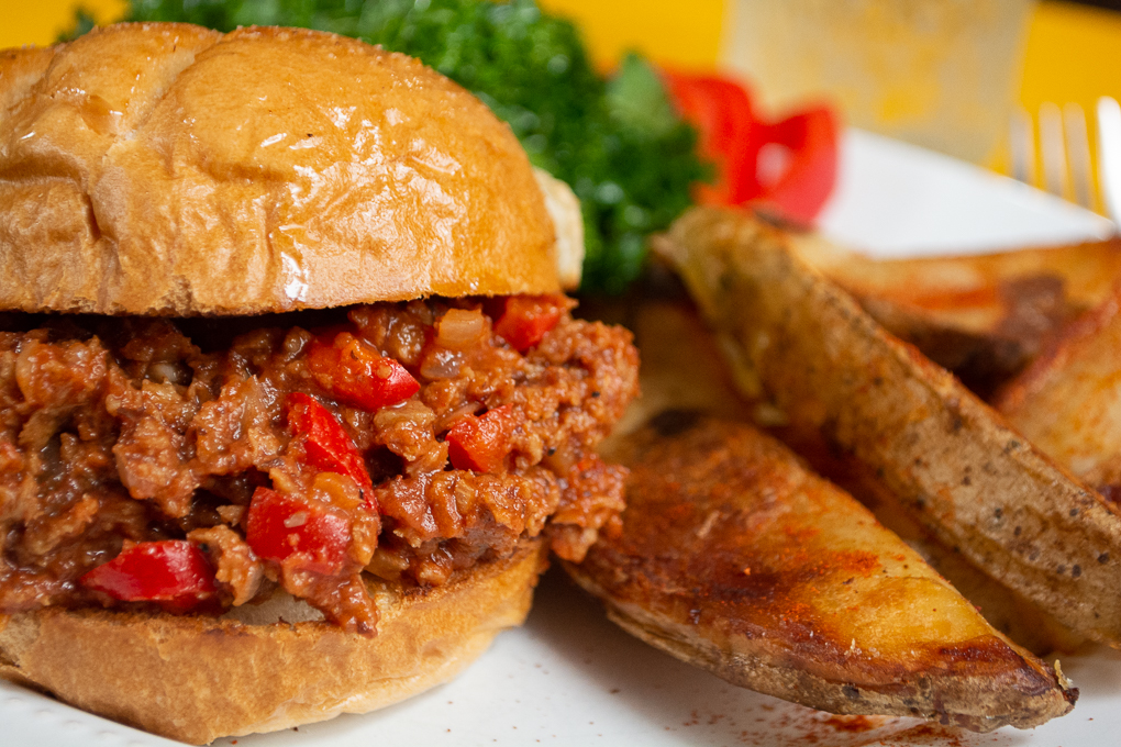 Vegan Sloppy Joe on toasted bun with steak fries