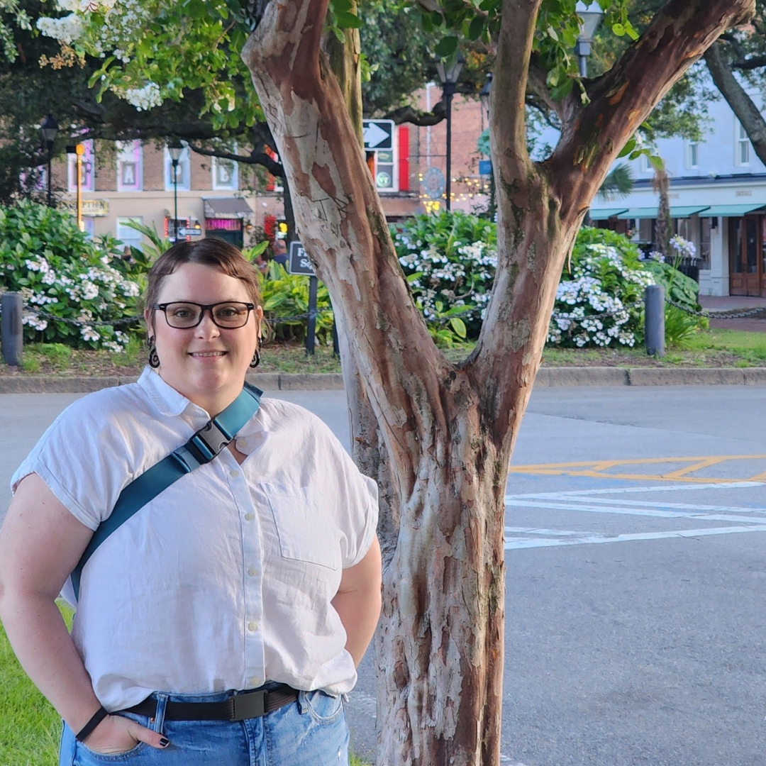 Sarah Householder standing under a tree