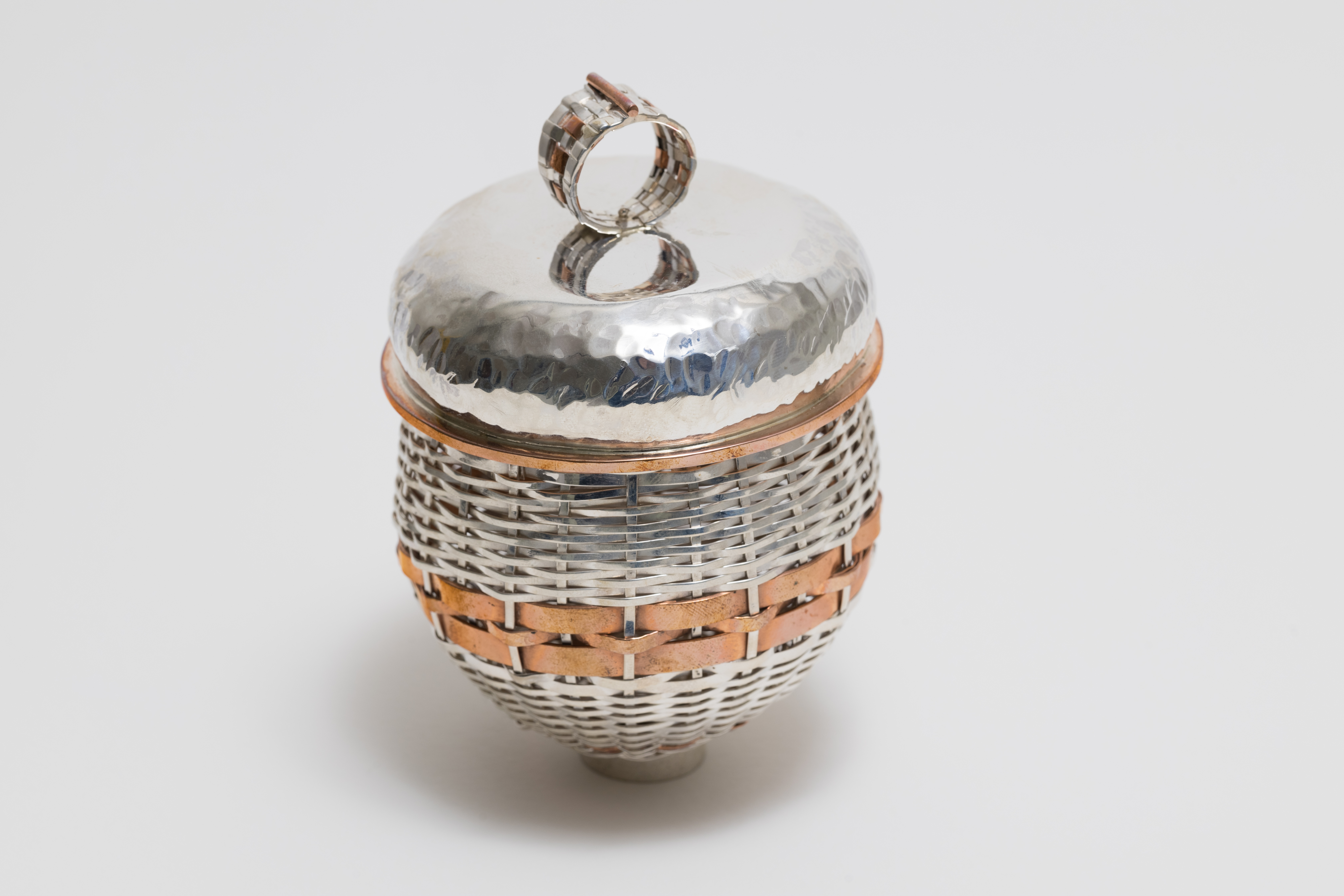 Silver basket created using traditional and metal basket-weaving techniques