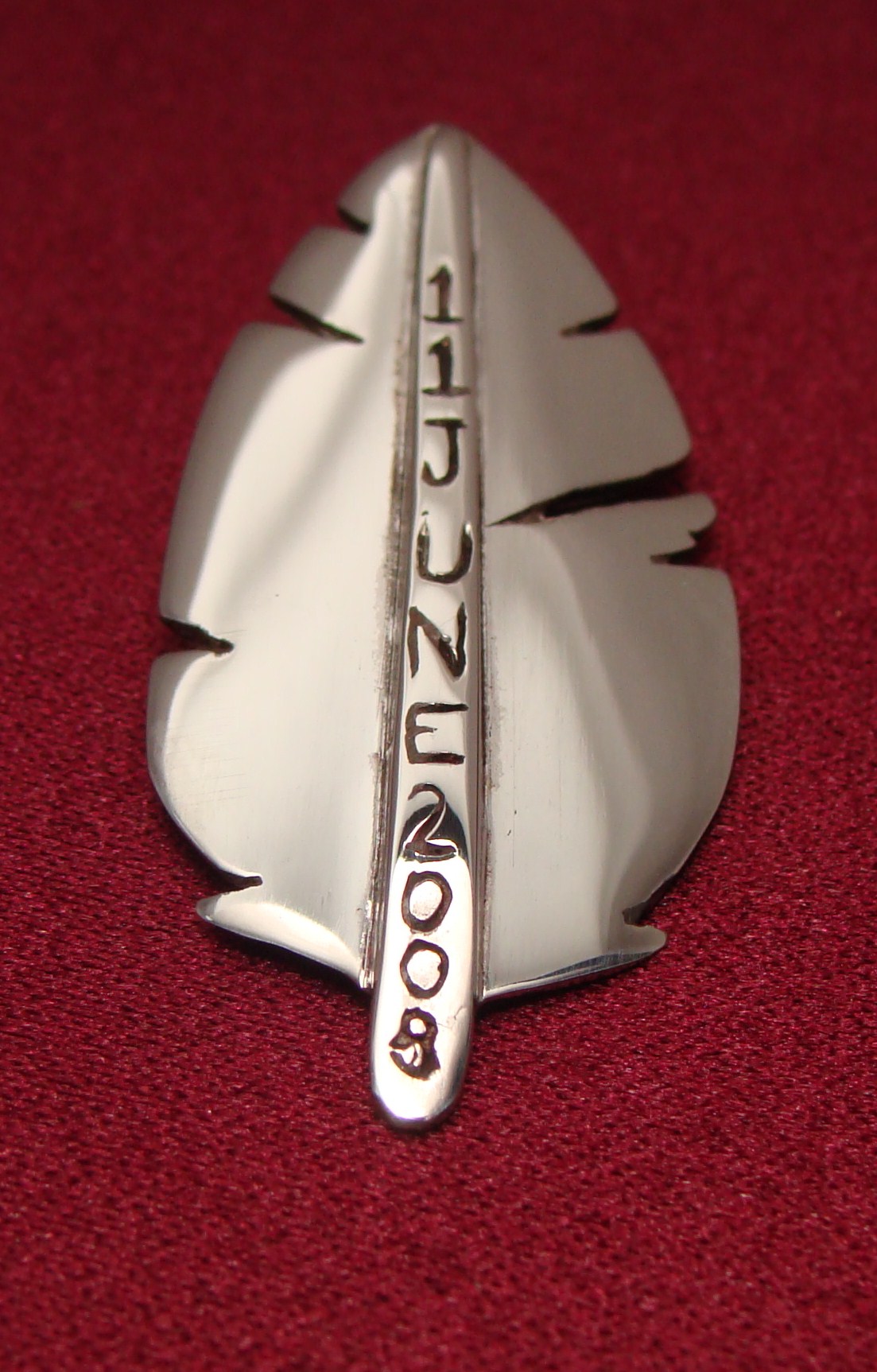 Residential School apology pin created by Wolastoq mixed media artist Shane Perley-Dutcher