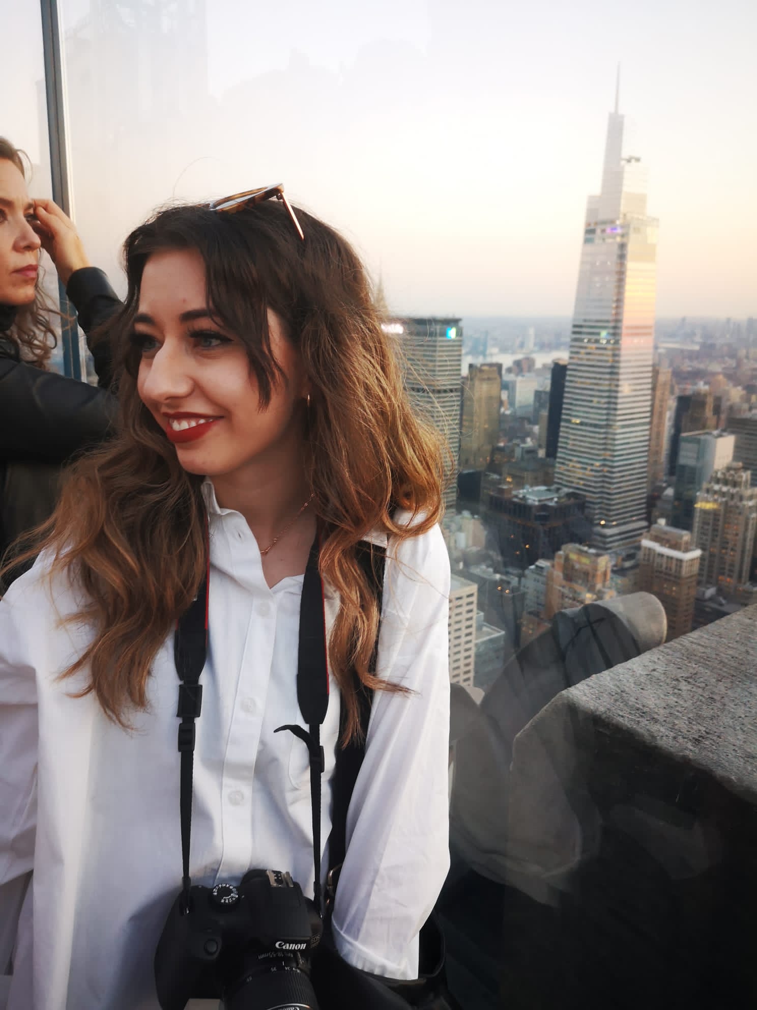 Image showing Rachel from CATCALL stood with New York City skyline in the background as seen from Top of the Rock at Rockefeller centre.