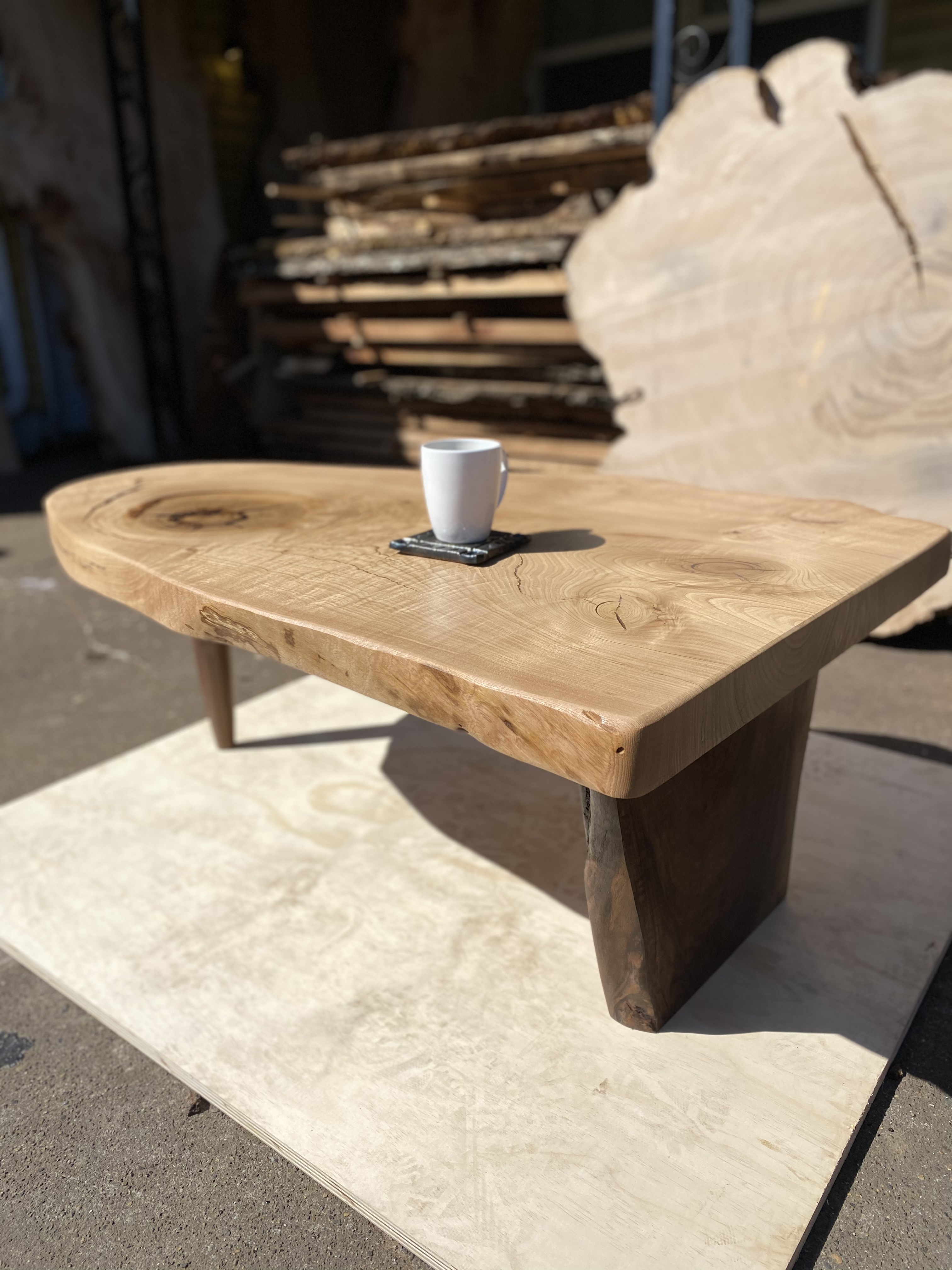 Nakashima inspired Conoid style coffee table in American Chestnut with walnut legs 