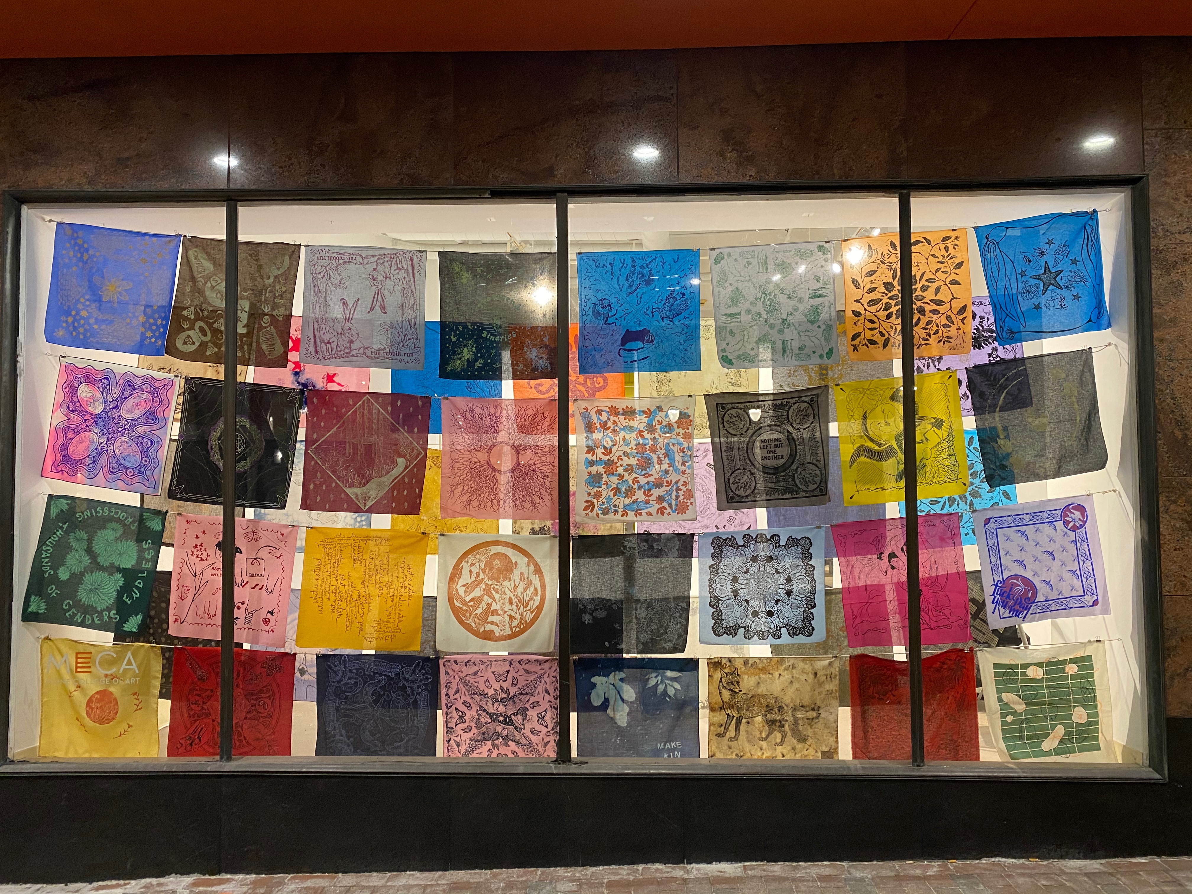 Bandanas hung in lines in the gallery window at MECA