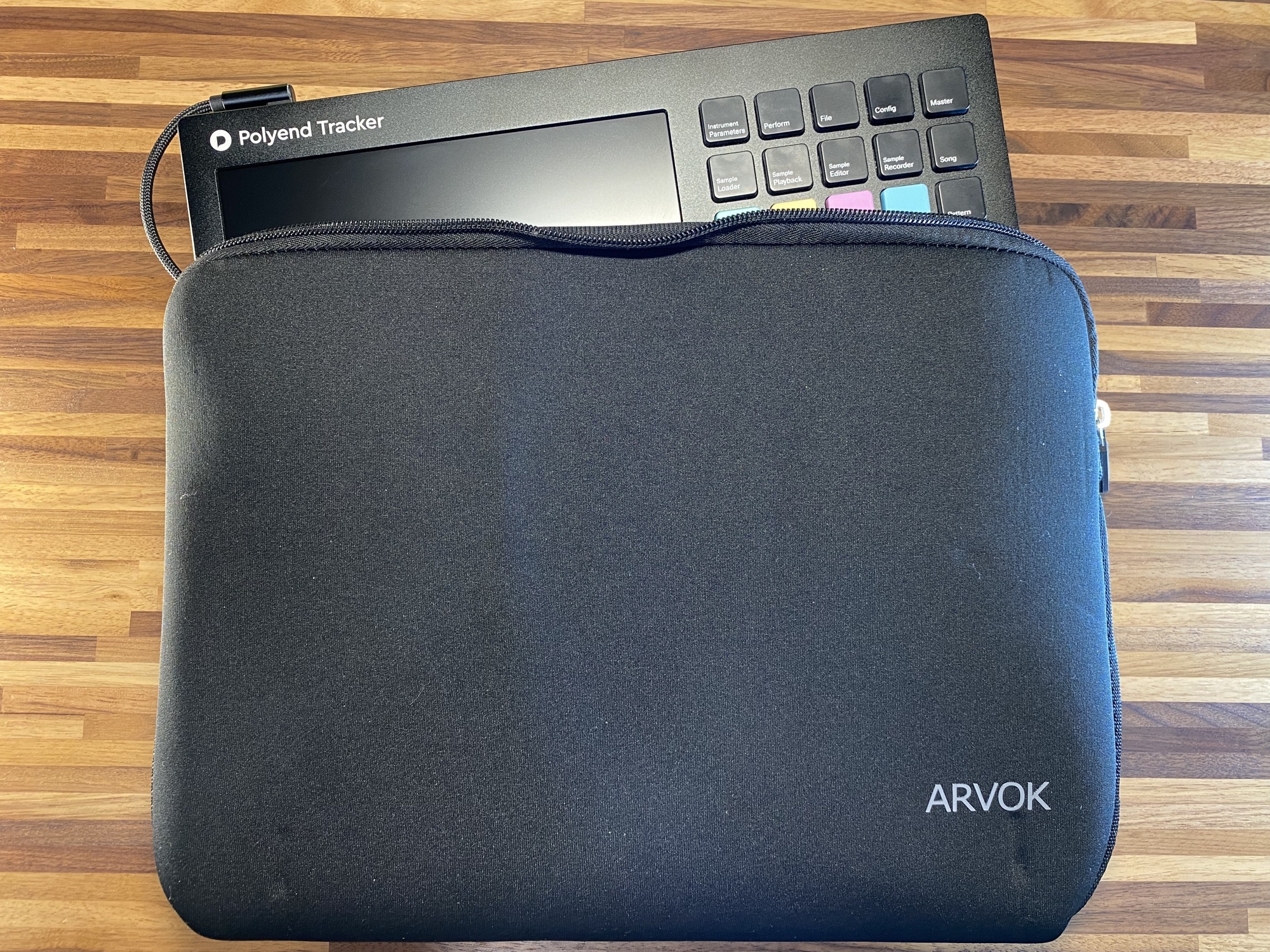 Polyend Tracker with accessories inside Arvok neoprene sleeve
