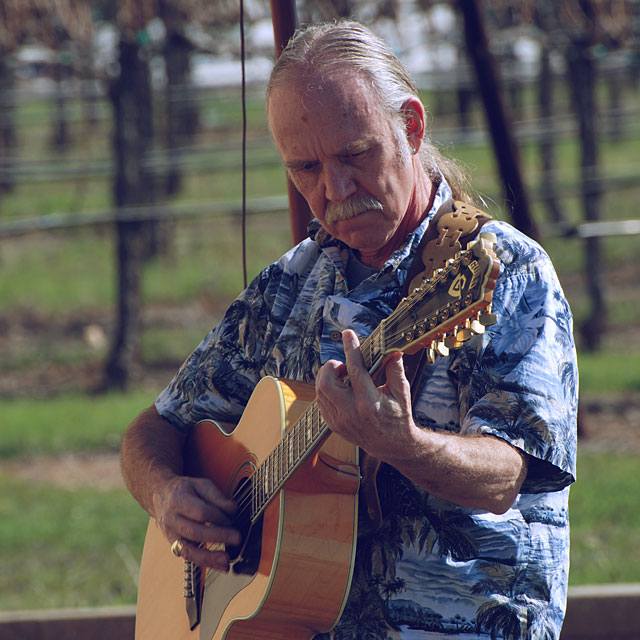Roger playing his 12-string Guild guitar
