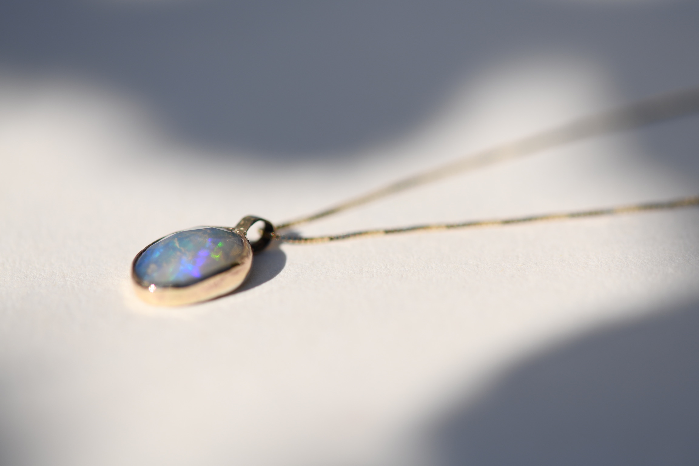 Welo opal necklace bezel set in 14k gold on a solid gold chain 