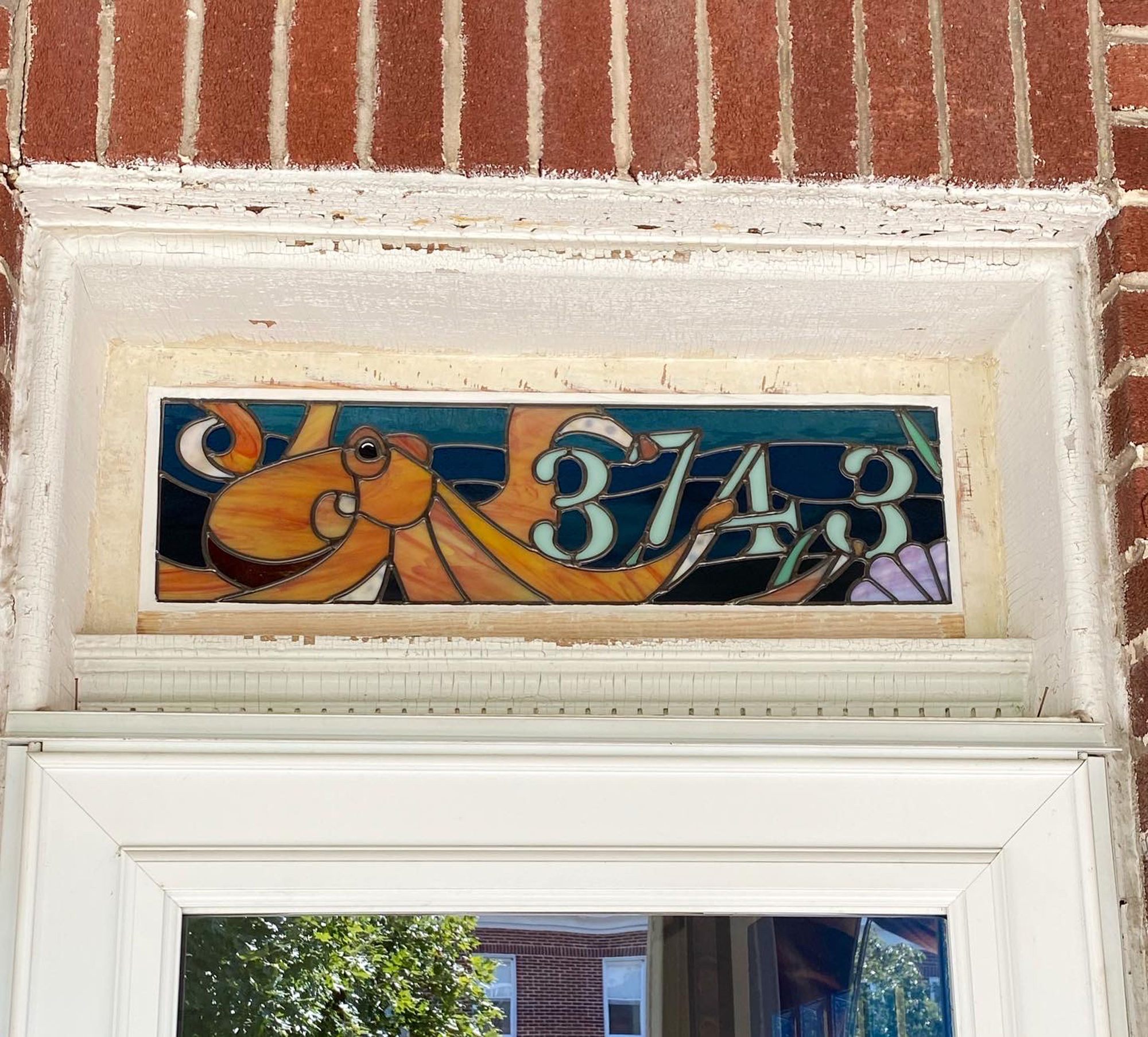 Stained glass transom with octopus