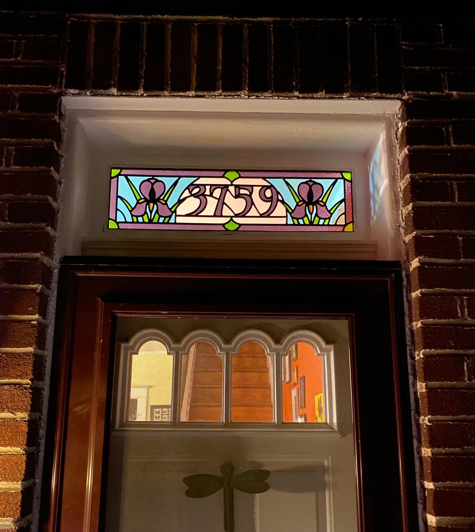 Stained glass transom with Iris