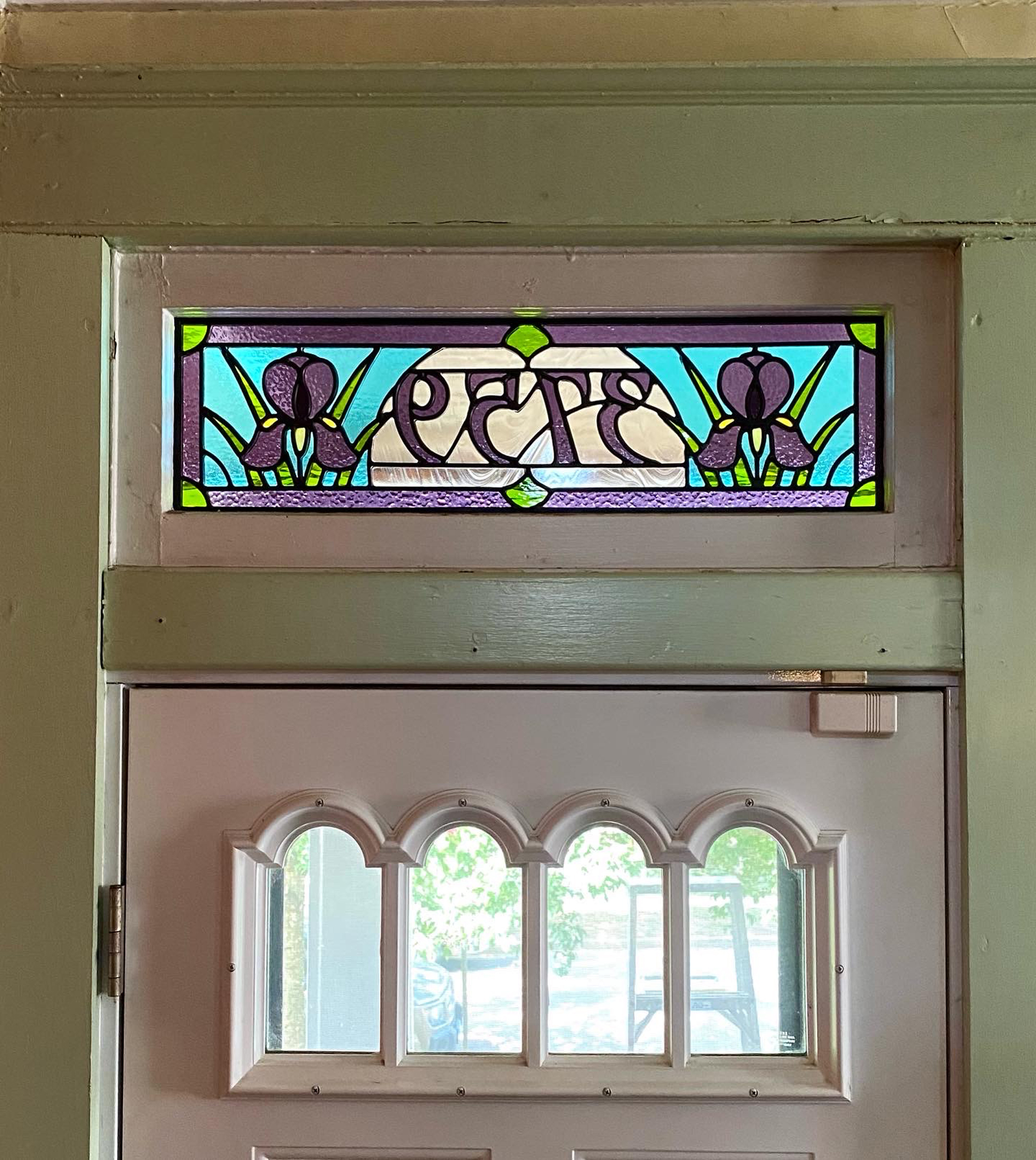 Stained glass transom with Iris