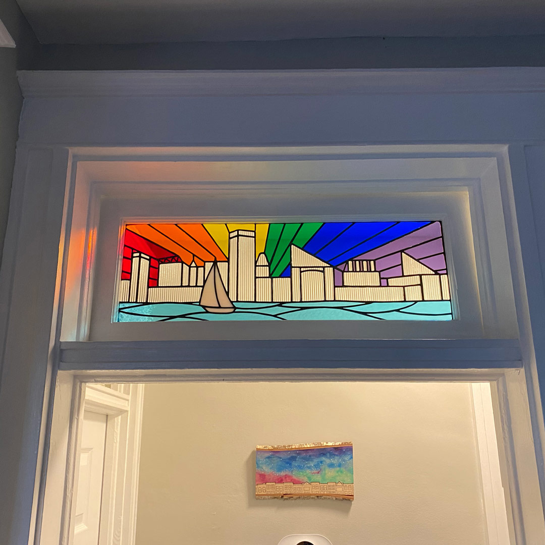 Stained glass transom with Baltimore and LGBT theme