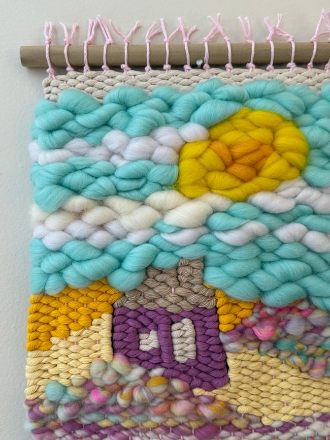 Little purple house & the aqua sky. Woven wall hanging.