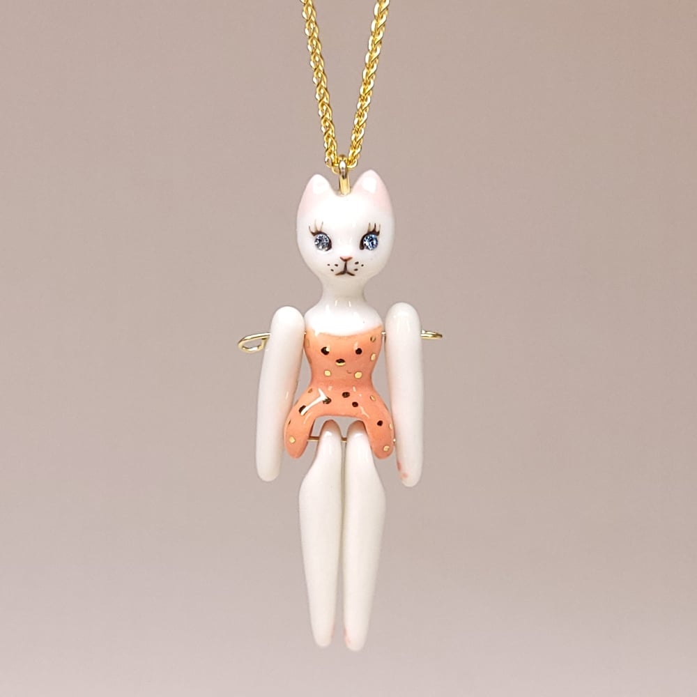 Image of White Porcelain & Gold Vermeil Articulated Doll Pendant