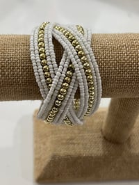 Image 1 of white and gold beaded cuff