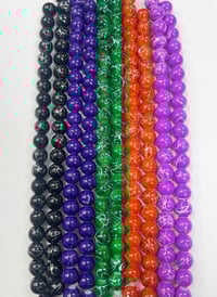 Image 2 of Painted glass bead strands.