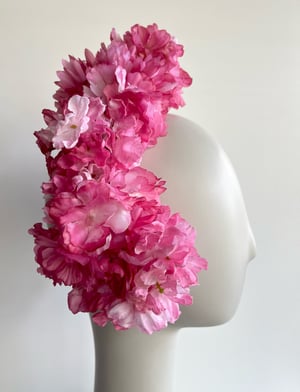 Image of Rose pink flower headpiece. 