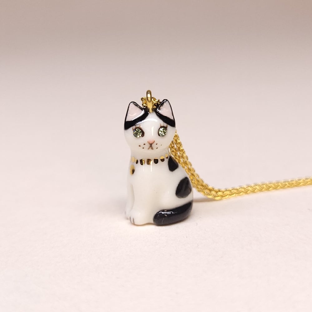 Image of Cow Cat Porcelain & Gold Vermeil Sitting Kitten Pendant