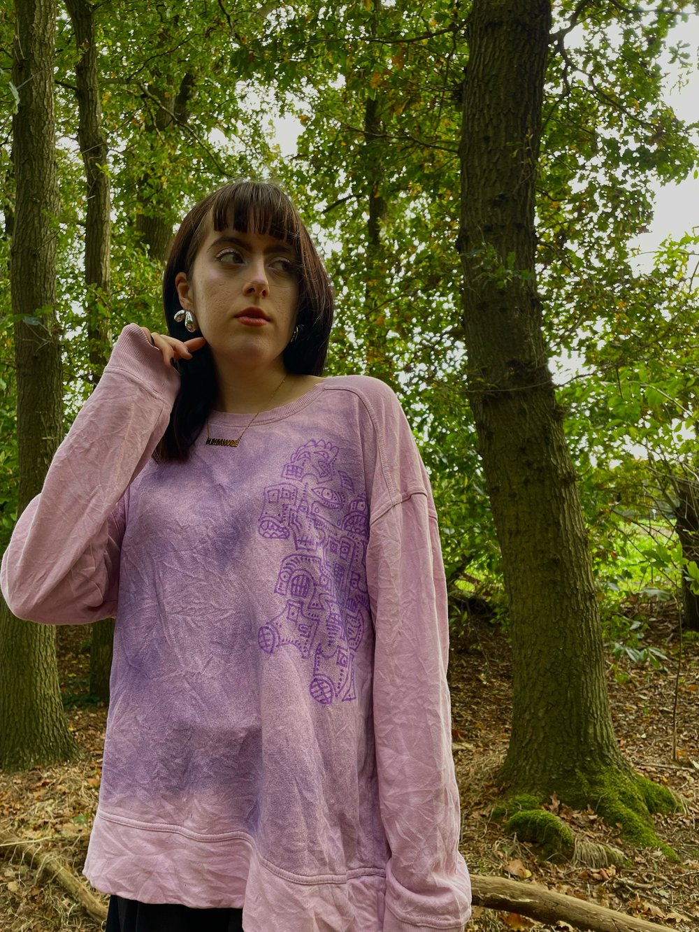 artsy pink sweater