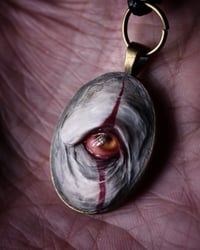Image 2 of Pennywise Eye glow in the dark pendant OOAK