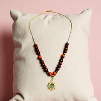 Bead and sun necklace