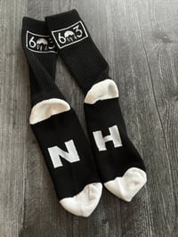 Image 2 of 603 black/white socks with NH on the bottom