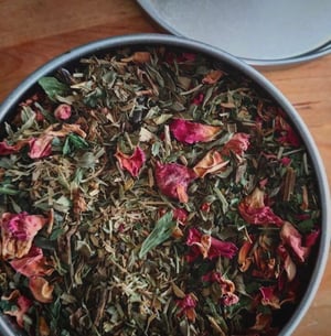 Image of Womens balancing tea