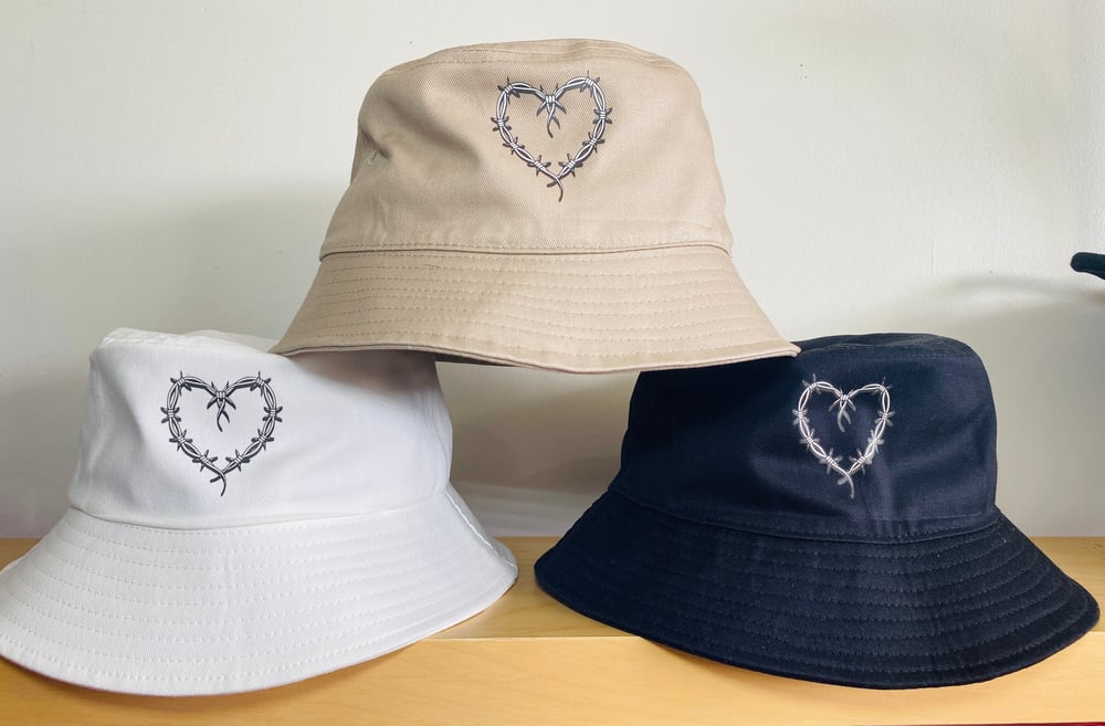 Image of KAROL G BARBWIRE HEART BUCKET HAT - SOLID COLORS 