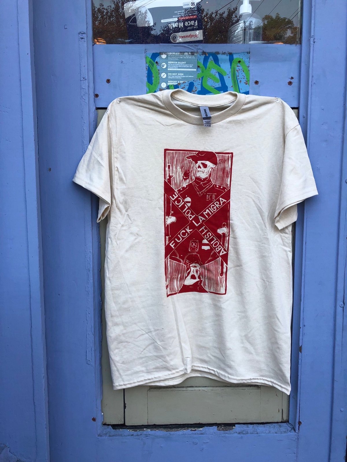 Image of white shirt red ink