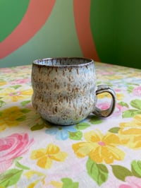 Image 1 of light blue speckled teacup