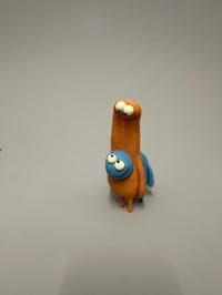 Image 7 of A blue thing peeking out of a brown thing 2