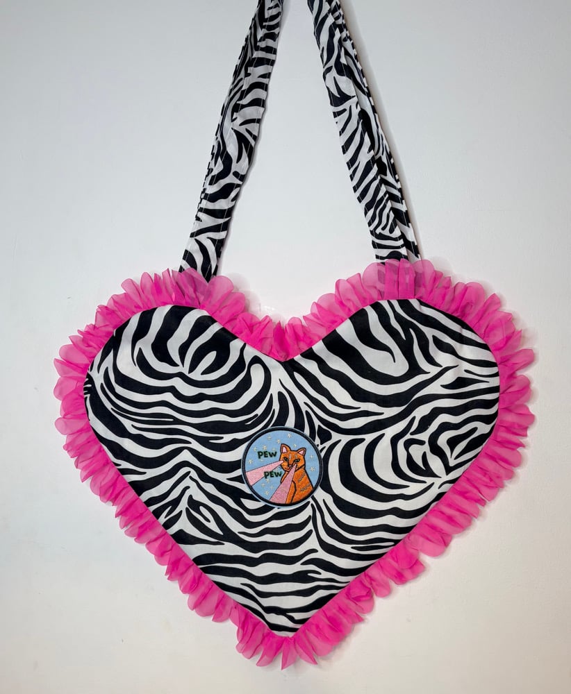 Image of 💖 Y2K Zebra Heart Bag with Pink Ruffle Trim & “Pew Pew” Patch