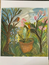 Image 2 of Two robins in a spring wild garden