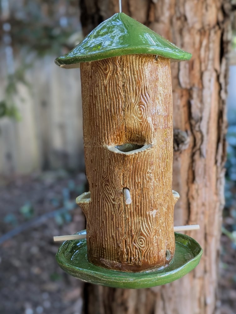 Image of handmade green and brown tall bird feeder 