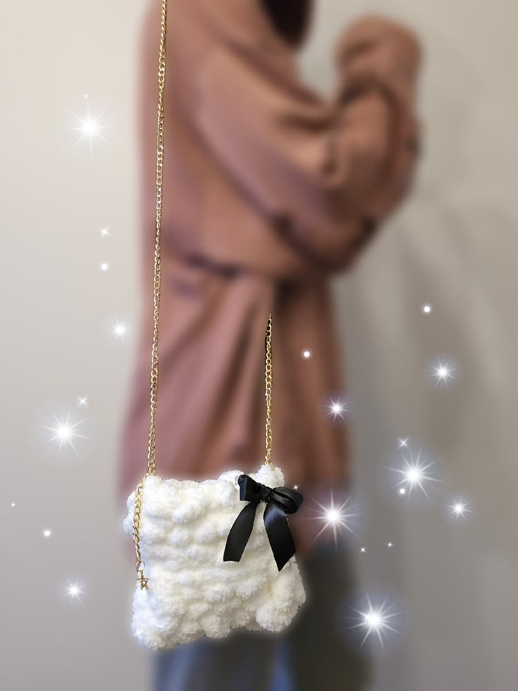 Image of off white fluffy knit purse