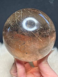 Image 12 of Golden Rutile In Smoky Quartz Sphere #1771